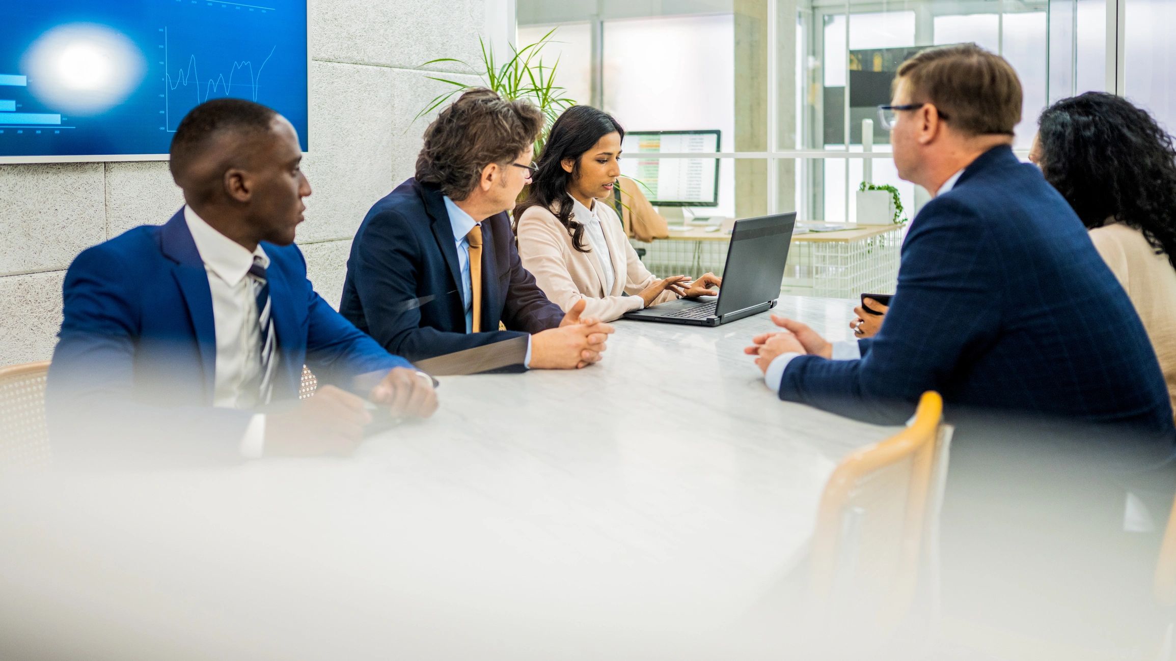 Life sciences professionals meeting at a conference table