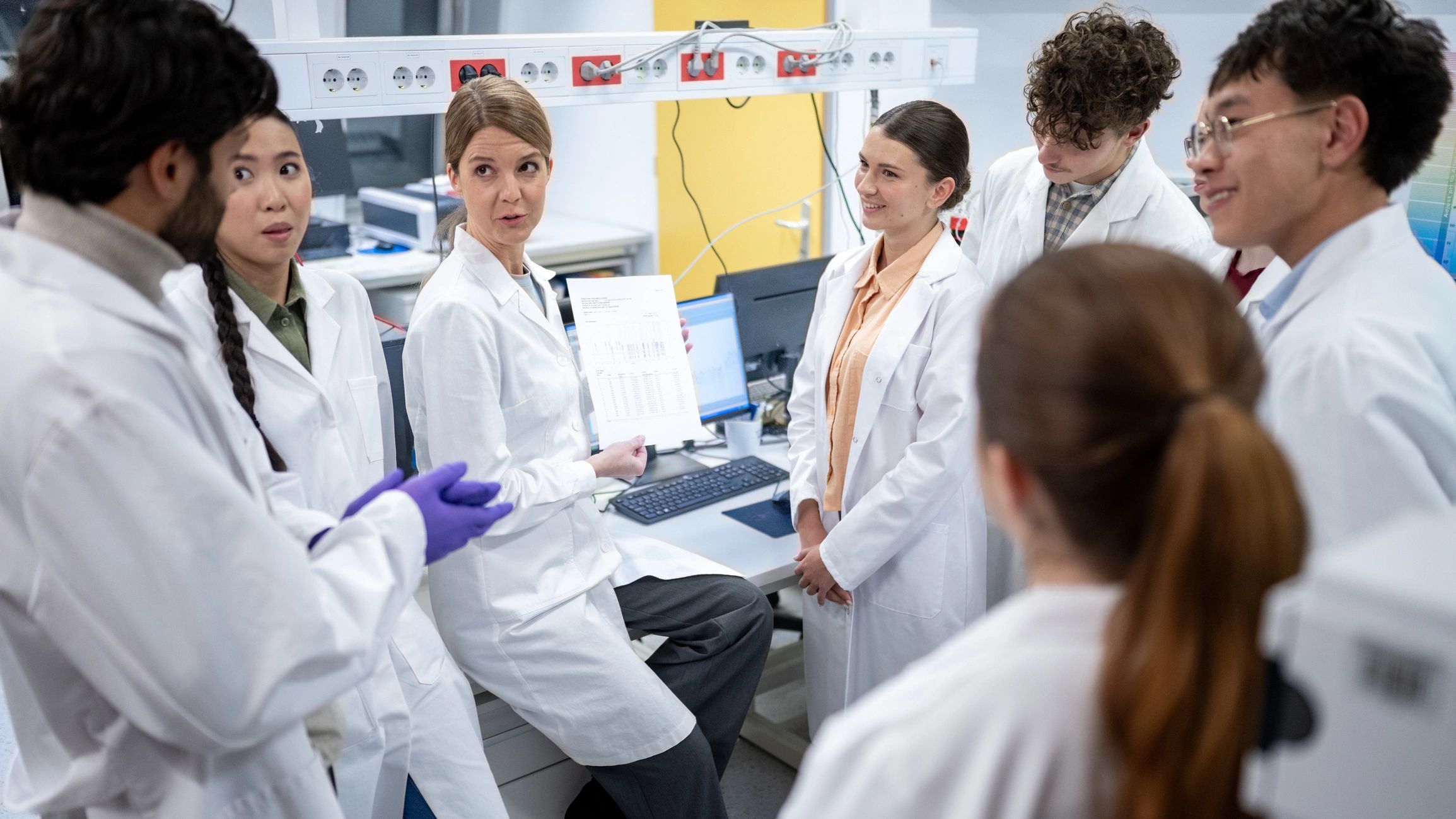 Scientists collaborating in a modern laboratory